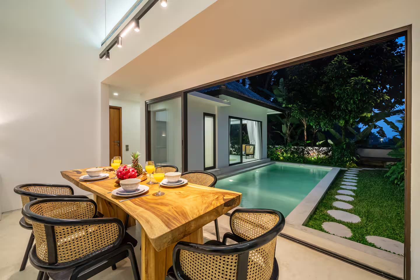 Dining room with poolside view at blue hour