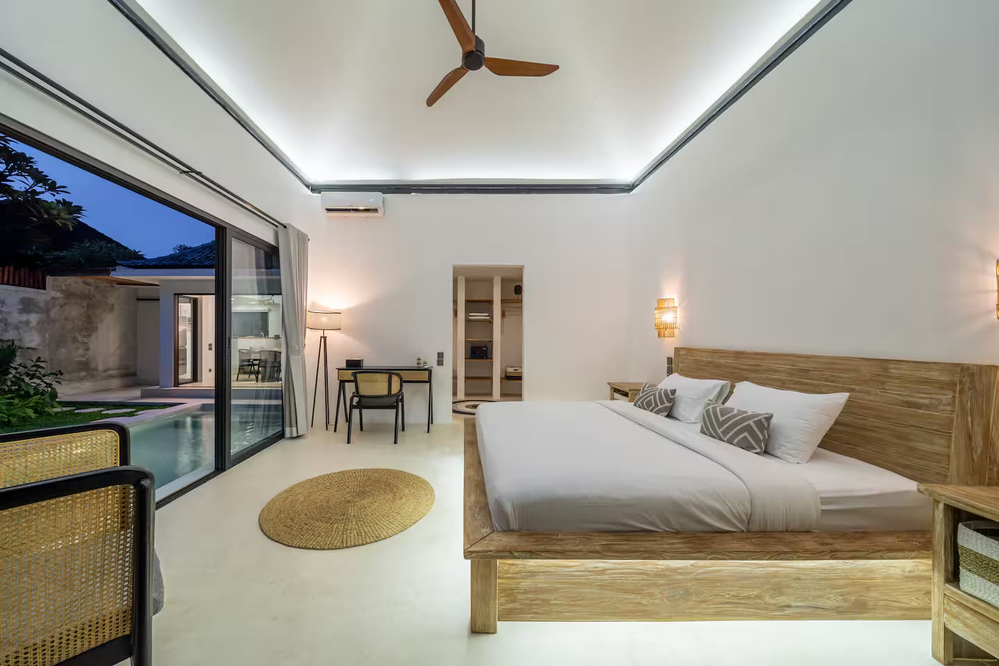 Master bedroom with pool view in the evening